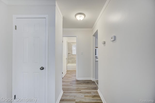22811 Sharrow Ave, Utica, MI 48089 - hallway featuring light wood-type flooring and ornamental molding