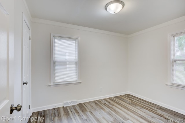 22811 Sharrow Ave, Utica, MI 48089 - unfurnished room with wood finished floors and ornamental molding