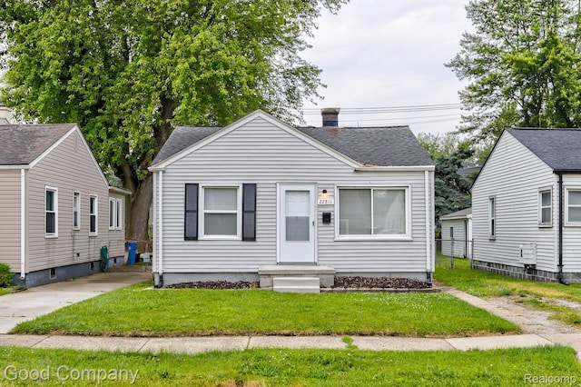 22811 Sharrow Ave, Utica, MI 48089 - bungalow featuring a front yard and a shingled roof