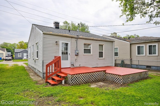 22811 Sharrow Ave, Utica, MI 48089 - rear view of property with a deck, a lawn, and a chimney