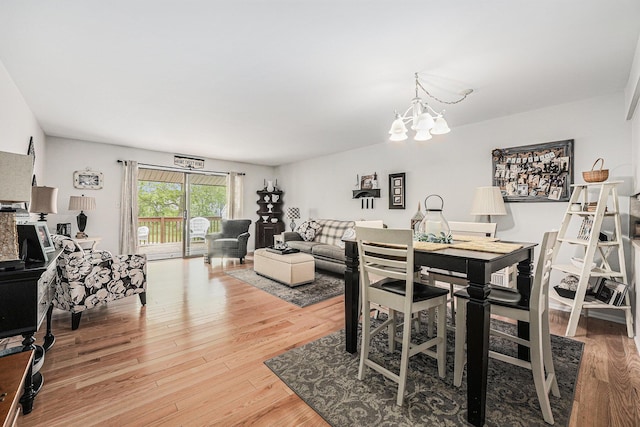 3431 Brookview Ct, Hudsonville, MI 49426 - dining space featuring light wood-style floors and a chandelier