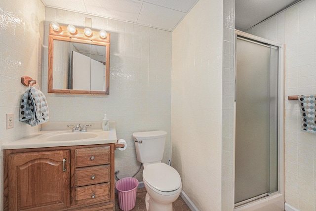 3431 Brookview Ct, Hudsonville, MI 49426 - full bathroom with a stall shower, vanity, toilet, tile walls, and tile patterned floors