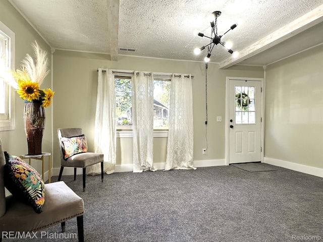 311 S Foster Ave, Lansing, MI 48912 - sitting room with a textured ceiling, plenty of natural light, carpet flooring, baseboards, and beamed ceiling