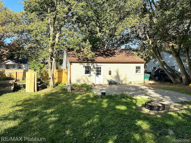 311 S Foster Ave, Lansing, MI 48912 - back of property with a fire pit
