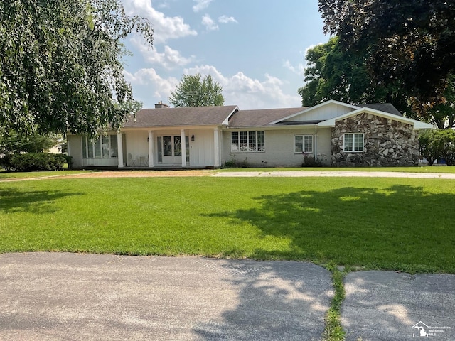 4845 E Dunbar Rd, Monroe, MI 48161 - ranch-style home with a front yard and a chimney
