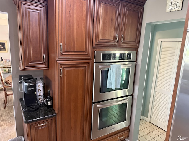 4845 E Dunbar Rd, Monroe, MI 48161 - kitchen with stainless steel double oven and light tile patterned floors
