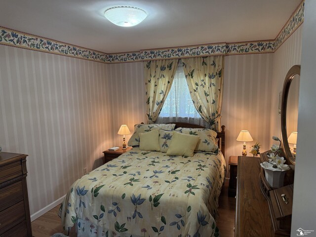 4845 E Dunbar Rd, Monroe, MI 48161 - bedroom with wood finished floors and wallpapered walls