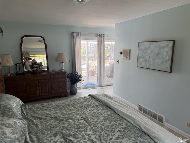 4845 E Dunbar Rd, Monroe, MI 48161 - bedroom featuring access to outside and baseboards