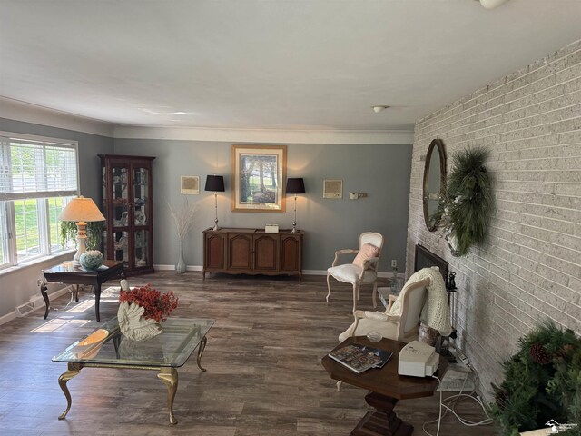 4845 E Dunbar Rd, Monroe, MI 48161 - living room with wood finished floors, brick wall, and a brick fireplace
