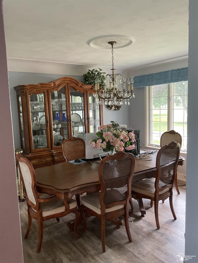 4845 E Dunbar Rd, Monroe, MI 48161 - dining space featuring a chandelier and wood finished floors