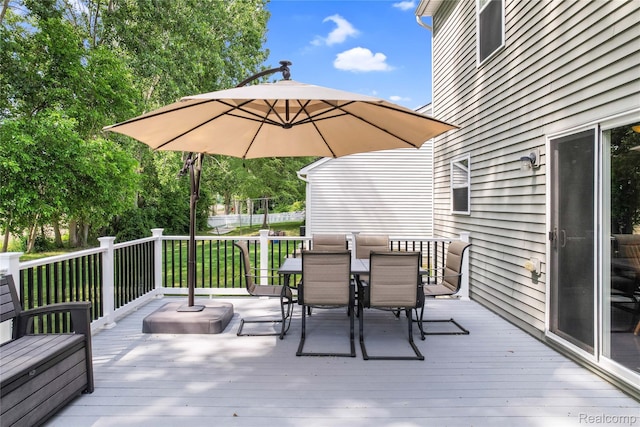 1029 Primrose Ln, Milan, MI 48160 - wooden terrace with outdoor dining area and a yard