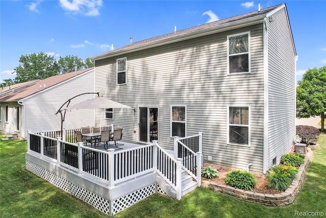 1029 Primrose Ln, Milan, MI 48160 - back of property featuring a lawn, a deck, and outdoor dining area