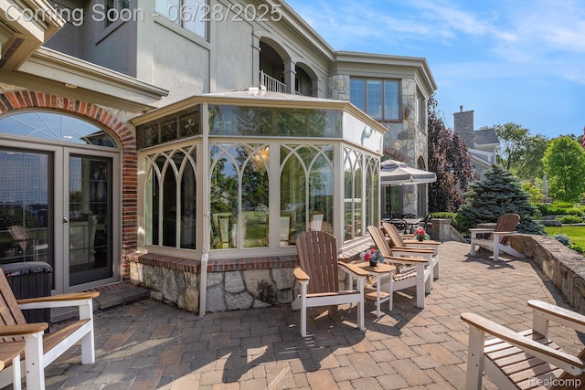 13123 Log Cabin Pt, Fenton, MI 48430 - view of patio / terrace featuring a sunroom
