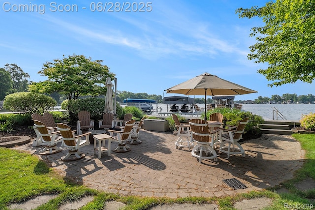 13123 Log Cabin Pt, Fenton, MI 48430 - view of patio / terrace with a water view and a fire pit