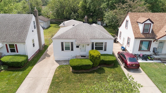 7491 Dacosta, Redford, MI 48239 - view of front facade featuring a front yard and roof with shingles