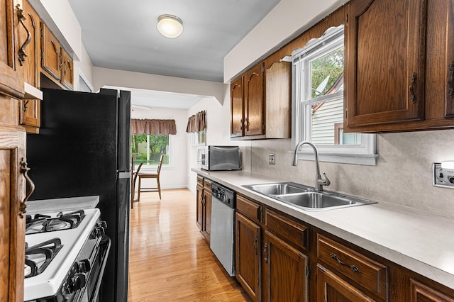 7491 Dacosta, Redford, MI 48239 - kitchen with appliances with stainless steel finishes, a sink, healthy amount of natural light, and light countertops