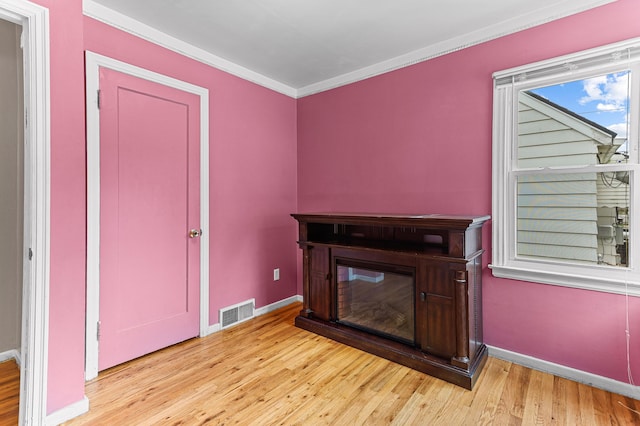 7491 Dacosta, Redford, MI 48239 - unfurnished living room with wood finished floors, baseboards, and crown molding