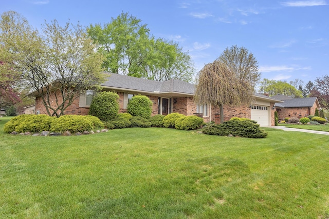 47545 Andrea Ct, Michigan, MI 48315 - view of front facade with brick siding, an attached garage, and a front lawn