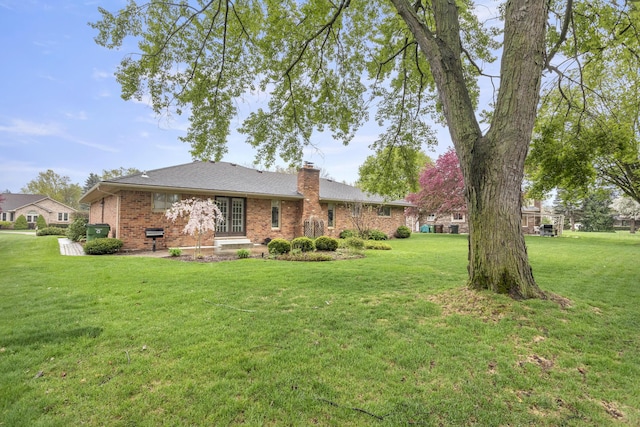 47545 Andrea Ct, Michigan, MI 48315 - back of house with a lawn, brick siding, and a chimney