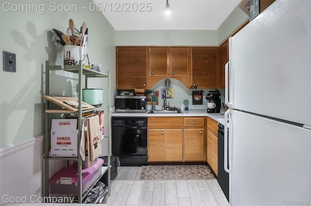 4345 Crooks Rd Unit 24, Royal Oak, MI 48073 - kitchen featuring freestanding refrigerator, black dishwasher, stainless steel microwave, light countertops, and light wood-type flooring