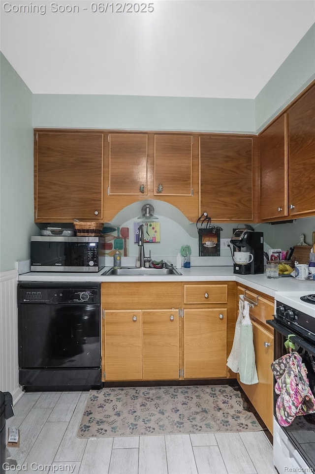4345 Crooks Rd Unit 24, Royal Oak, MI 48073 - kitchen with black dishwasher, stainless steel microwave, light countertops, and range
