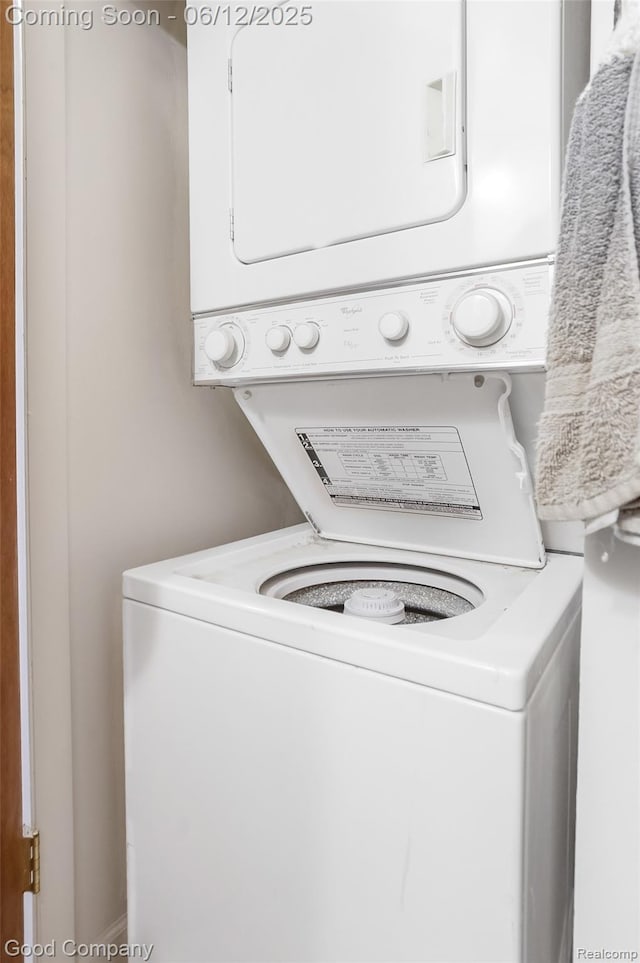 4345 Crooks Rd Unit 24, Royal Oak, MI 48073 - washroom featuring stacked washing machine and dryer