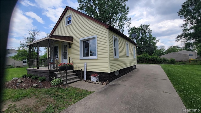 20470 Colman St S, Clinton Township, MI 48035 - view of front of home with a front yard and covered porch