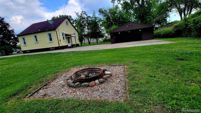 20470 Colman St S, Clinton Township, MI 48035 - view of green lawn featuring a fire pit and a detached garage
