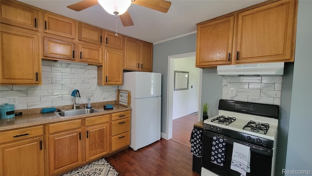 20470 Colman St S, Clinton Township, MI 48035 - kitchen with gas range, under cabinet range hood, freestanding refrigerator, decorative backsplash, and ceiling fan