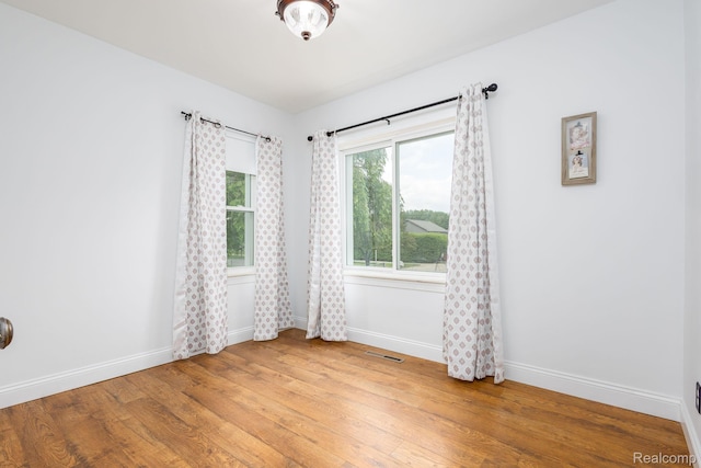 20470 Colman St S, Clinton Township, MI 48035 - empty room featuring baseboards and light wood-style flooring