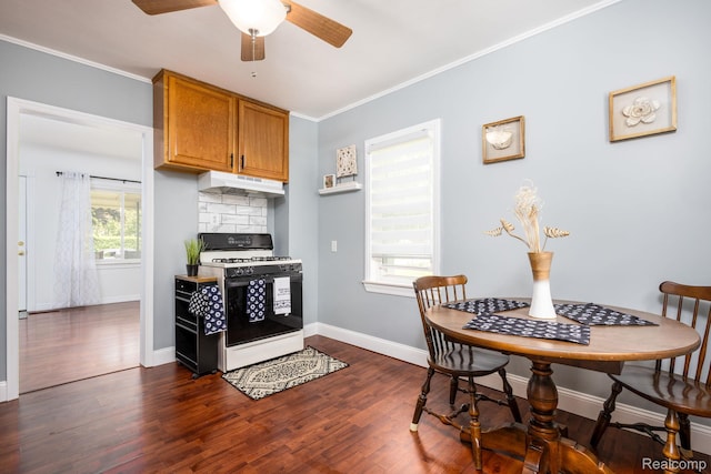 20470 Colman St S, Clinton Township, MI 48035 - kitchen with gas range gas stove, under cabinet range hood, dark wood-style floors, ceiling fan, and ornamental molding
