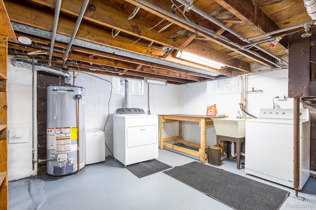 20470 Colman St S, Clinton Township, MI 48035 - basement featuring gas water heater, washing machine and dryer, and a workshop area