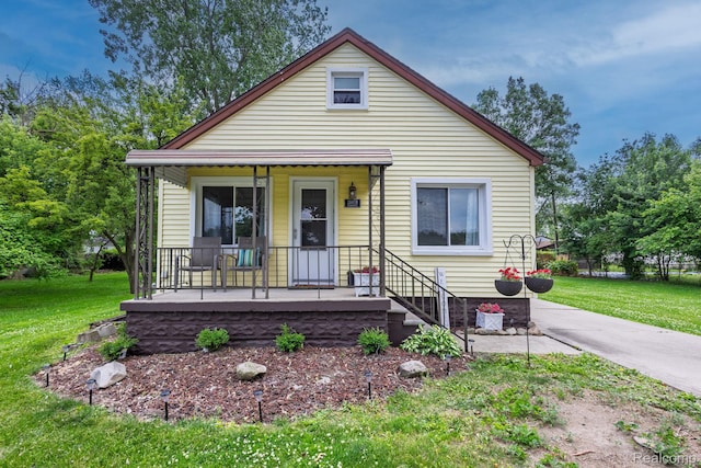 20470 Colman St S, Clinton Township, MI 48035 - view of front of house featuring covered porch and a front yard