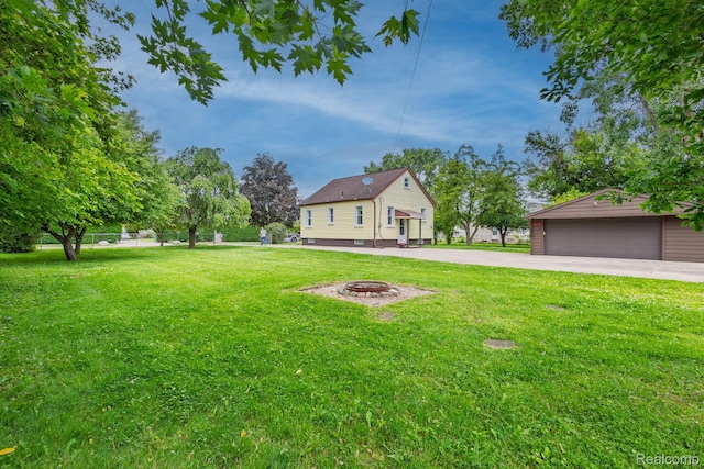 20470 Colman St S, Clinton Township, MI 48035 - view of yard with an outbuilding, an outdoor fire pit, and a garage