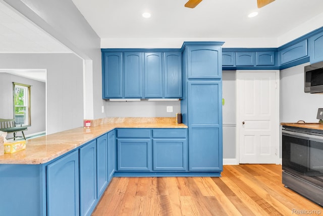 5276 Van Orden Rd, Webberville, MI 48892 - kitchen featuring range with electric stovetop, blue cabinetry, stainless steel microwave, and recessed lighting