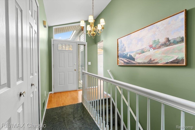 48728 Sundance Ct, Shelby Twp, MI 48315 - foyer featuring a chandelier and wood finished floors