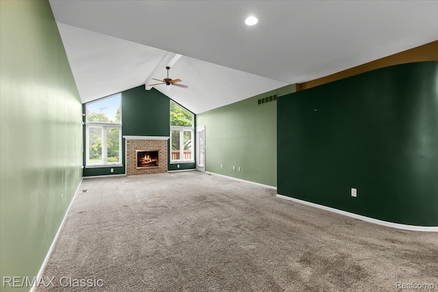 48728 Sundance Ct, Shelby Twp, MI 48315 - unfurnished living room featuring ceiling fan, carpet flooring, a fireplace, and vaulted ceiling