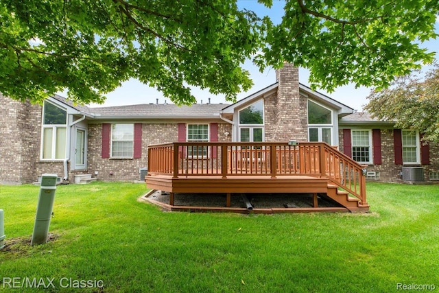 48728 Sundance Ct, Shelby Twp, MI 48315 - rear view of property featuring a chimney, brick siding, a deck, and a yard