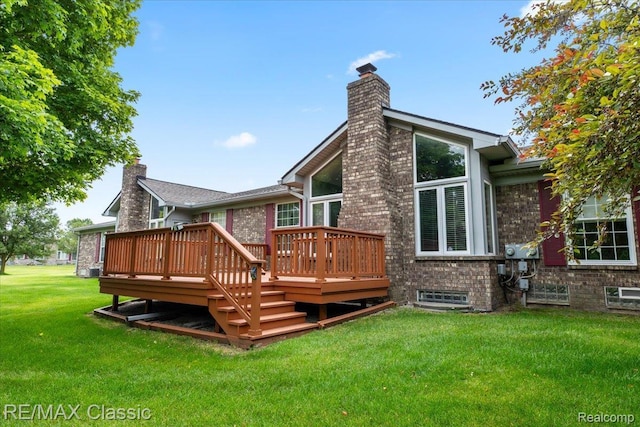 48728 Sundance Ct, Shelby Twp, MI 48315 - back of property with a chimney, a deck, a lawn, and brick siding