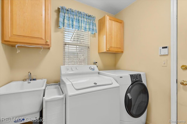 48728 Sundance Ct, Shelby Twp, MI 48315 - laundry room featuring cabinet space and washer and dryer