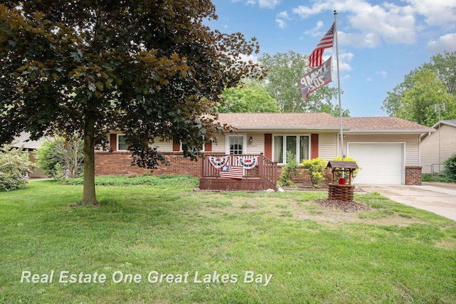 3404 Waldo Ave, Midland, MI 48642 - ranch-style house featuring an attached garage, brick siding, driveway, and a front yard