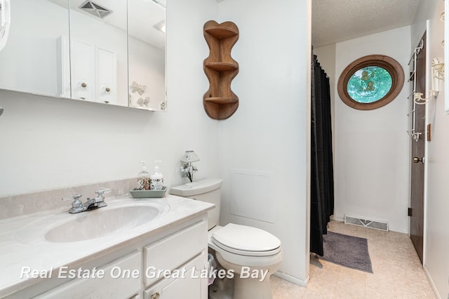 3404 Waldo Ave, Midland, MI 48642 - full bathroom featuring vanity, toilet, curtained shower, and tile patterned floors
