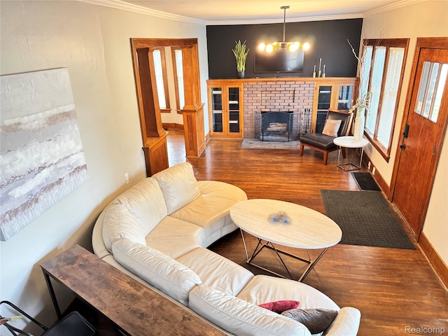 1202 Pershing St, Flint, MI 48503 - living room with ornamental molding, wood finished floors, and a brick fireplace