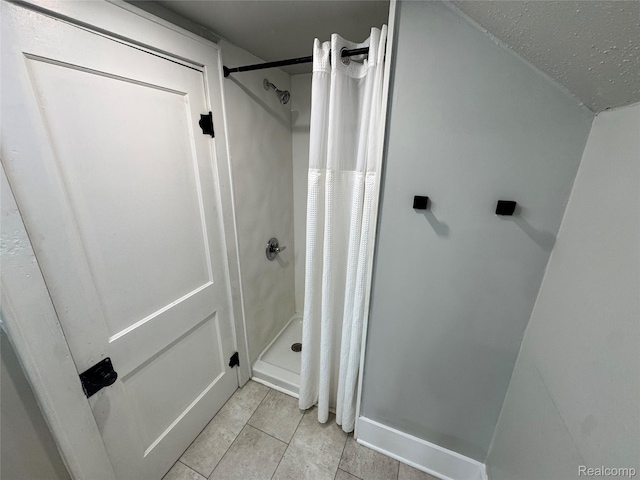 1202 Pershing St, Flint, MI 48503 - bathroom with a stall shower and tile patterned floors