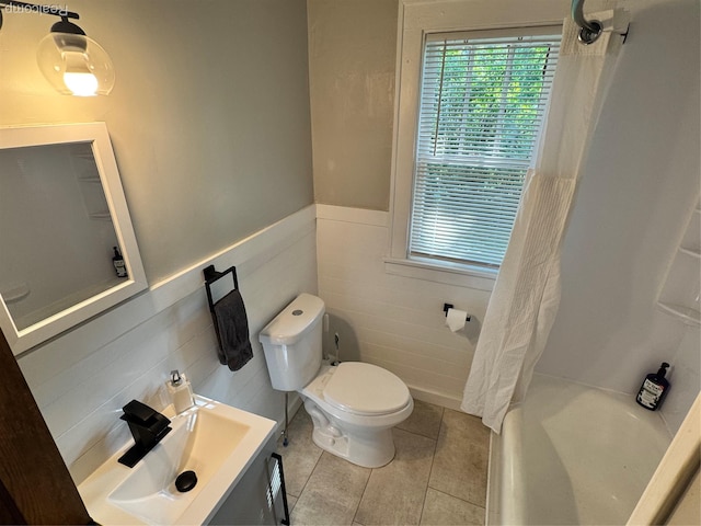 1202 Pershing St, Flint, MI 48503 - full bath featuring wainscoting, tile walls, tile patterned floors, and vanity