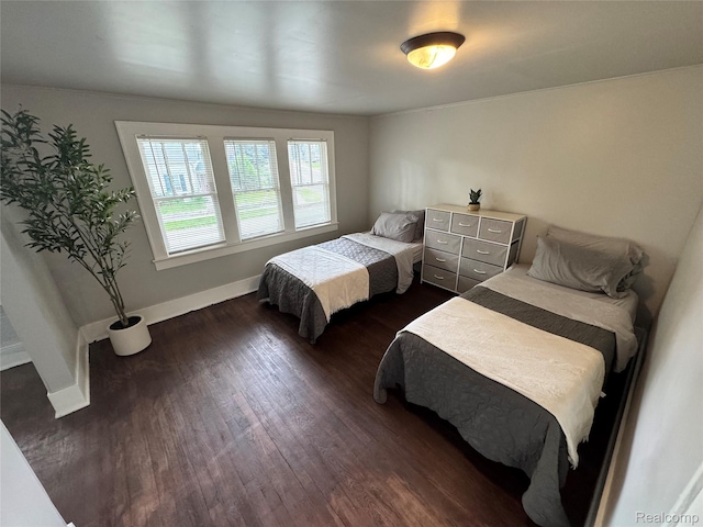 1202 Pershing St, Flint, MI 48503 - bedroom featuring baseboards and dark wood finished floors