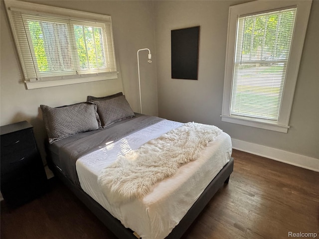 1202 Pershing St, Flint, MI 48503 - bedroom featuring dark wood-style floors and baseboards