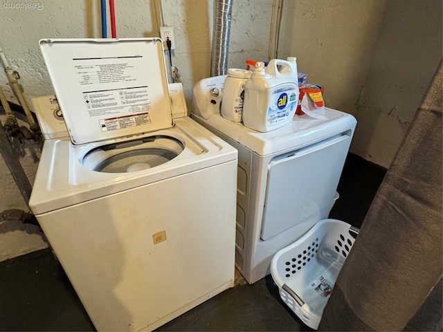 1202 Pershing St, Flint, MI 48503 - washroom featuring washing machine and dryer and a textured wall