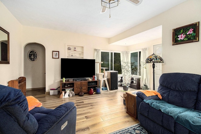 51 Dunning Ave, Battle Creek, MI 49037 - living room featuring light wood finished floors and arched walkways