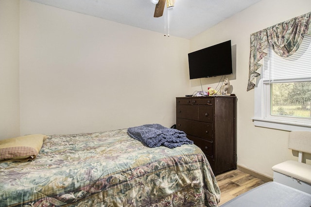 51 Dunning Ave, Battle Creek, MI 49037 - bedroom with wood finished floors, baseboards, and ceiling fan
